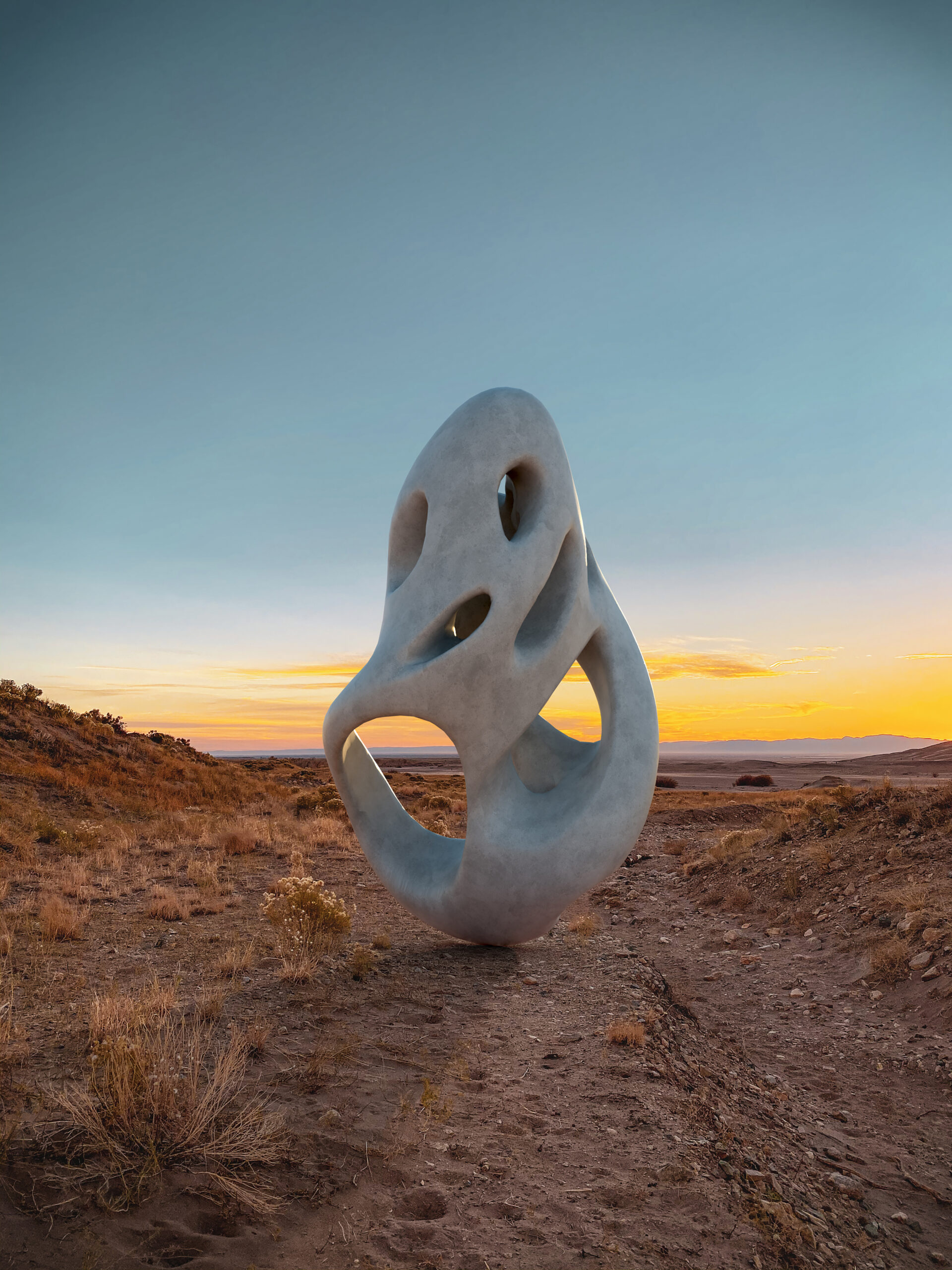 Eceertrey - reflective sculptural form placed in a desert landscape